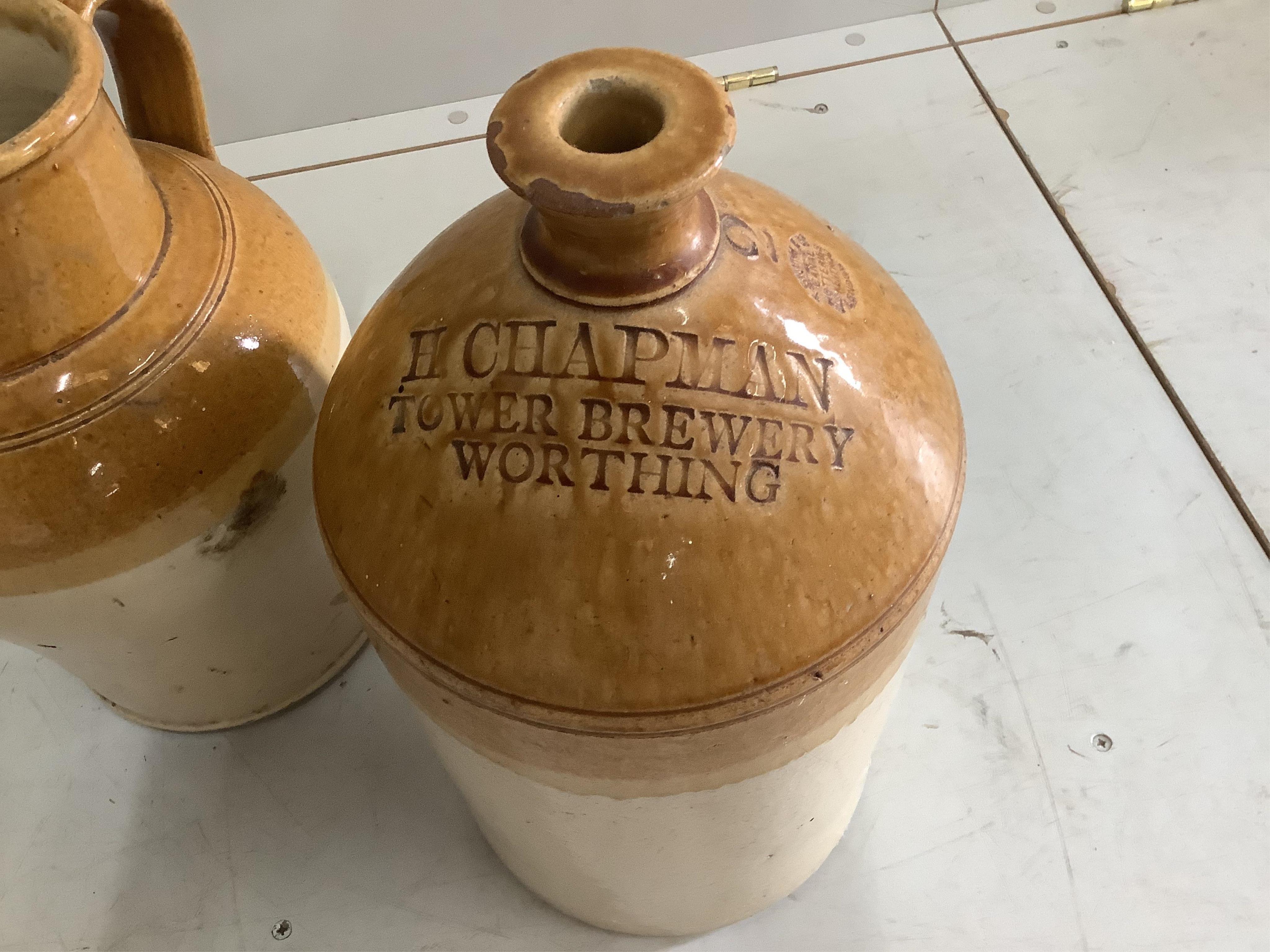 A Victorian Doulton Lambeth glazed earthenware ewer, a similar ewer and a Worthing beer flagon, largest height 41cm. Condition - good